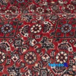 C Persia Handwoven Rug - Luxurious Red Design 196x102x1 cm room styling and scale (In-room view)