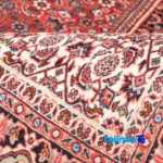 Cypress Handwoven Area Rug Luxurious Red - In-room view showing room styling and scale