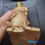 Side view of Bronze Sailor Figurine Anchor & Fish Barrel profile and structure