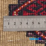Handwoven Persian Carpet Model Baluch - In-room view showing room styling and scale